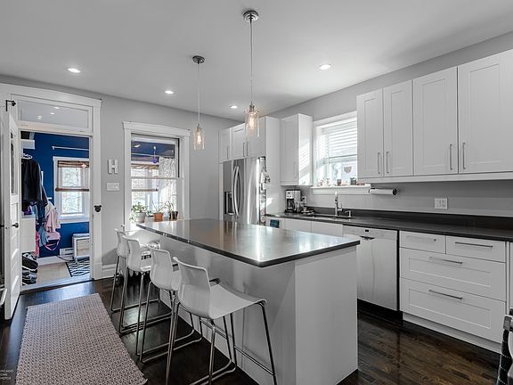 Bright kitchen with lots of cabinetry and island seating
