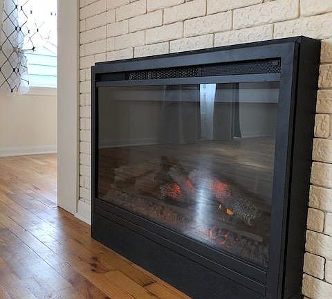 Cozy electric fireplace in the living room.