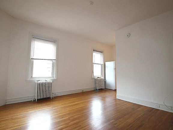 Living Room (Unfurnished) with 2 windows overlooking Pine Street