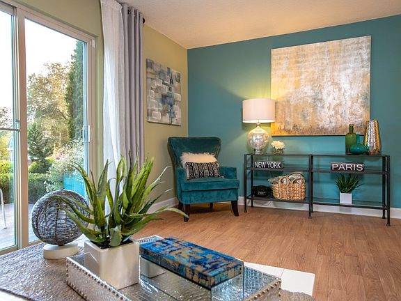 Bright and airy living area with lovely wood-like flooring