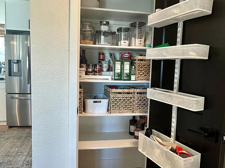 Spacious pantry with Elfa door storage