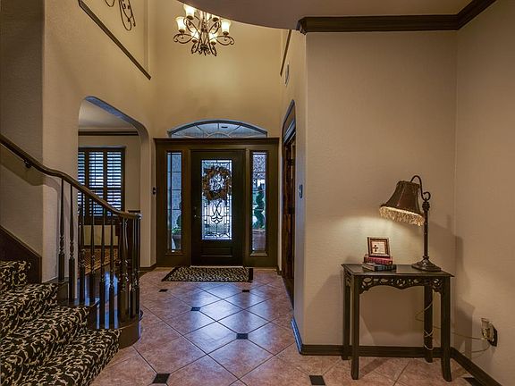 Enter home through heavy wood door with leaded glass. The study and formal dining are flanked on either side.