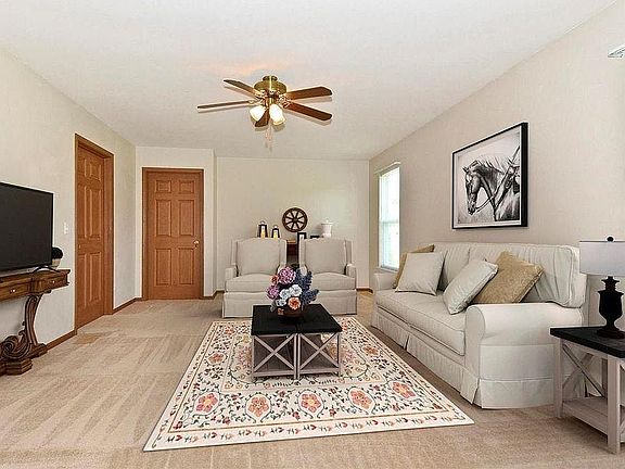 additional family room in rear corner of home makes for a perfect TV room