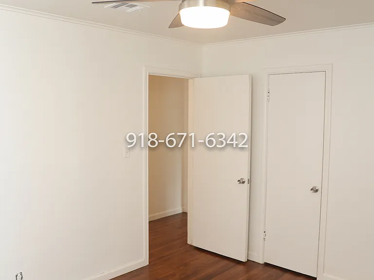 Primary bedroom showing hallway, and door to one of the closets.