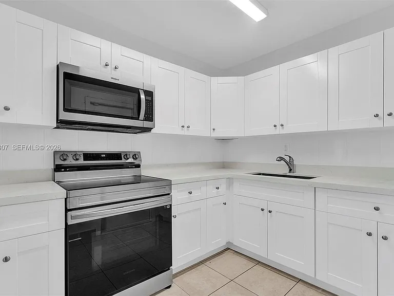 551 NW 30th Ter — Photo 9