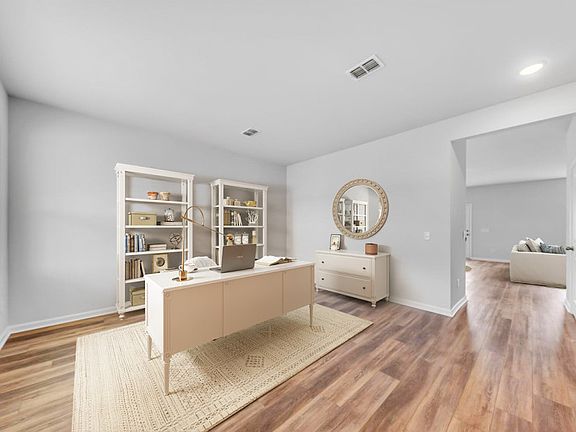 Utilize this bright and welcoming flex room as a peaceful study space.