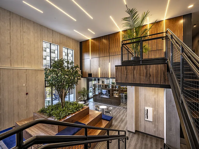 Modern and Open Concept Bilevel Lobby. Viewpoint Standing on Stair Landing.