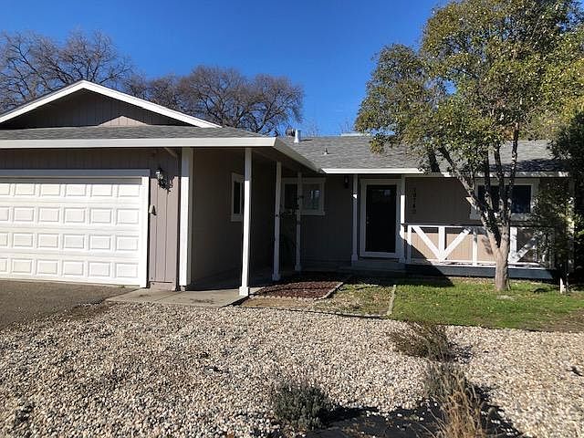 Extra parking in gravel area on other side of garage.
