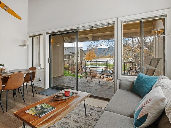 Enjoy the courtyard and lake front views out the living room windows and patio