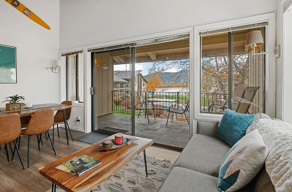 Enjoy the courtyard and lake front views out the living room windows and patio