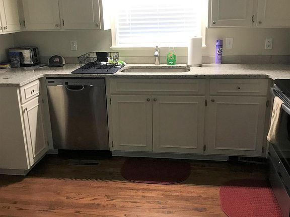 Kitchen features granite countertops and single bowl sink