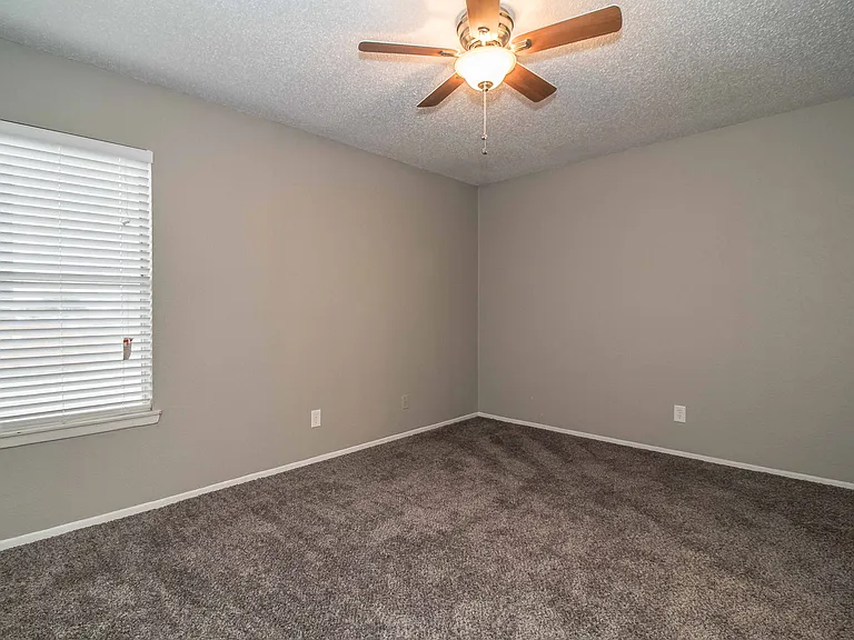 Rest easy in a cozy bedroom designed for comfort and relaxation.