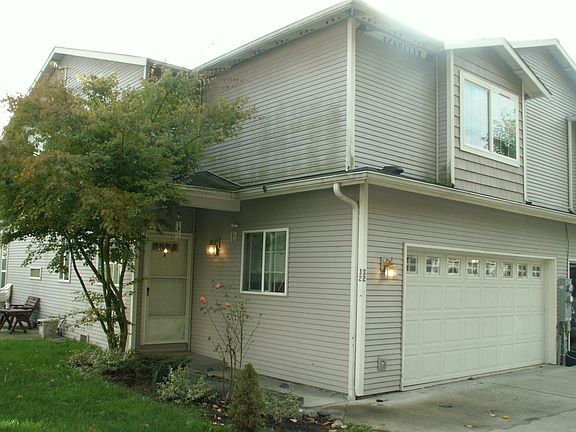 Side view of the front of the house.. there is a fence now.