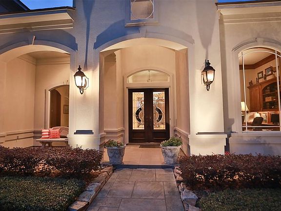 DOUBLE LEAD GLASS FRONT DOOR - This home makes a striking first impression with covered front porch and solid wood front doors.