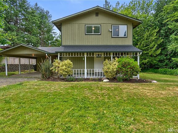 On your left you will see the carport for 2 (And there is another 1 car garage/shop behind that!)