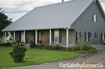 Front
						:
						Professional landscape with irrigation, reclaimed cypress double front doors