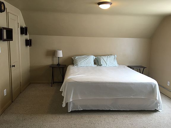 Upstairs carpeted bedroom