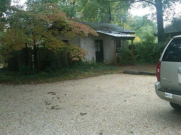Back building 1 room and 1/2 bath, brick interior
