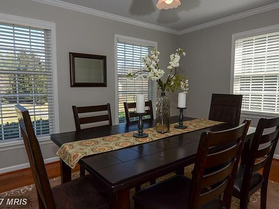 Front facing light filled dining room.
