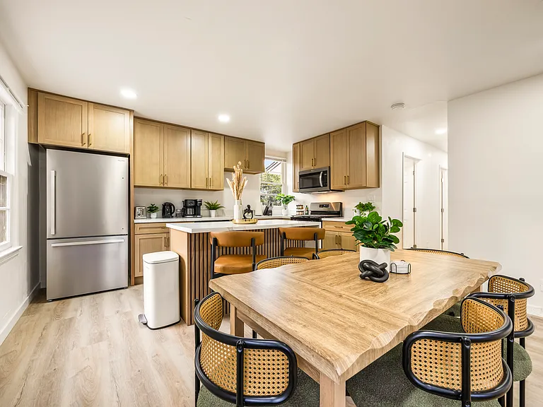 Dining area offers a comfortable space for shared meals, morning coffee, or game nights.