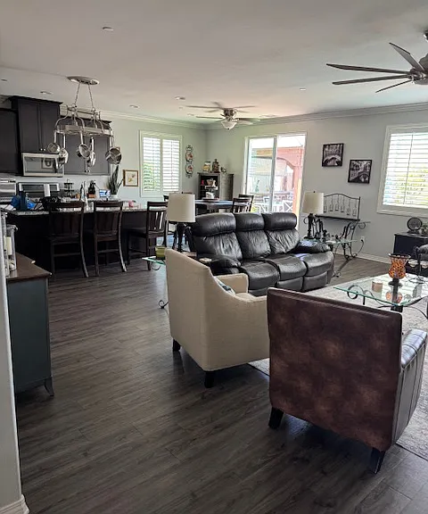 Open design - family room, kitchen with island and view of patio.