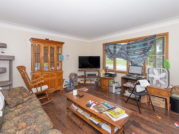 Large front living room area with new laminate flooring.