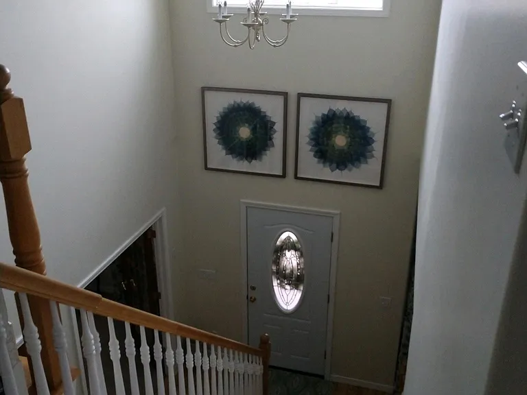 View of two story entry from second floor.
