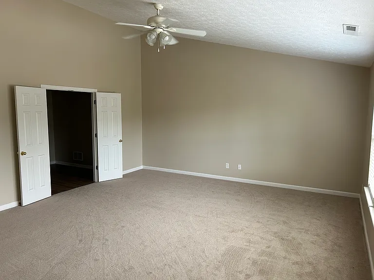 Master bedroom with vaulted ceiling
