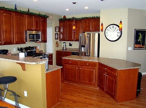 Kitchen with Cherry Cabinets and Stainless Appliances
