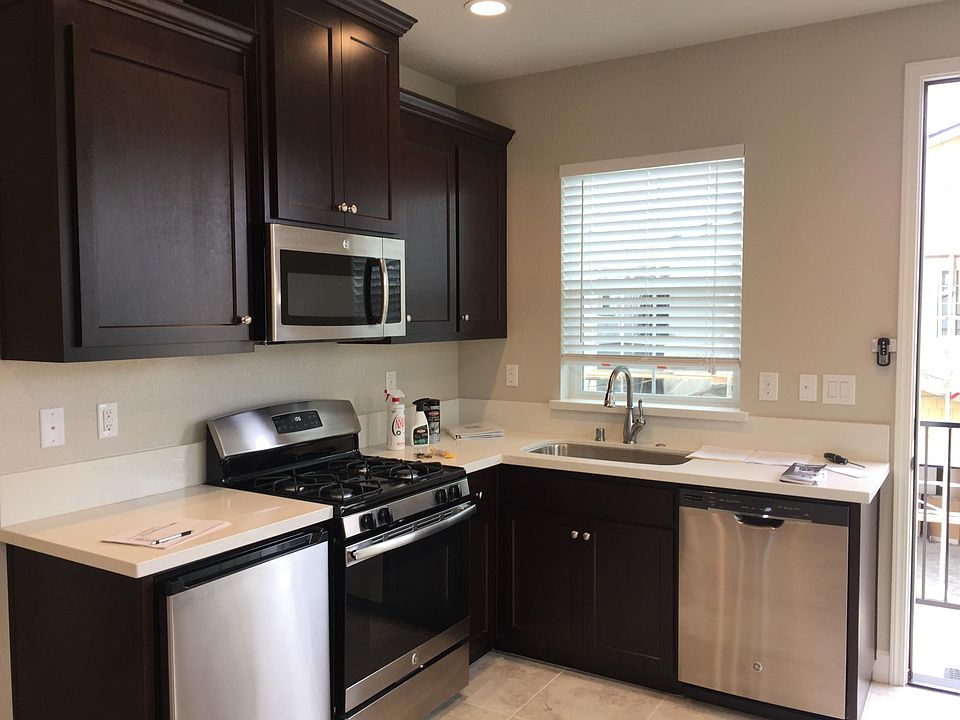 Kitchen with Gas stove & oven, microwave, small refrigerator and dishwasher.