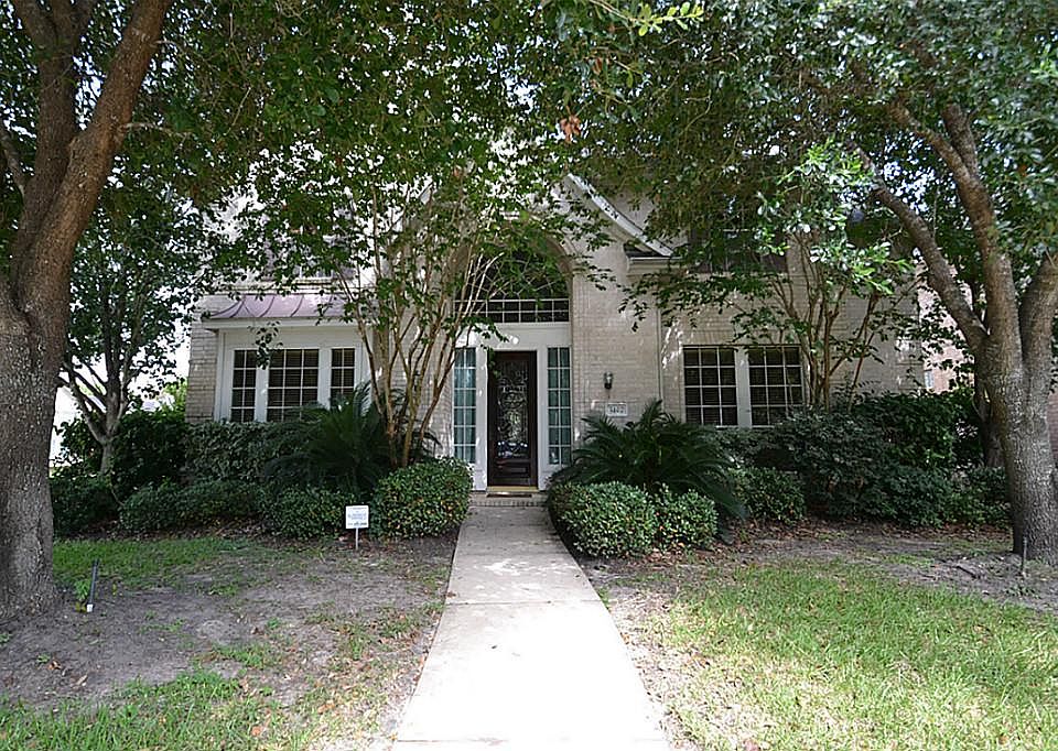 Front view of this outstanding home located in a gated lake community located at 5407 Emerald Bark.
