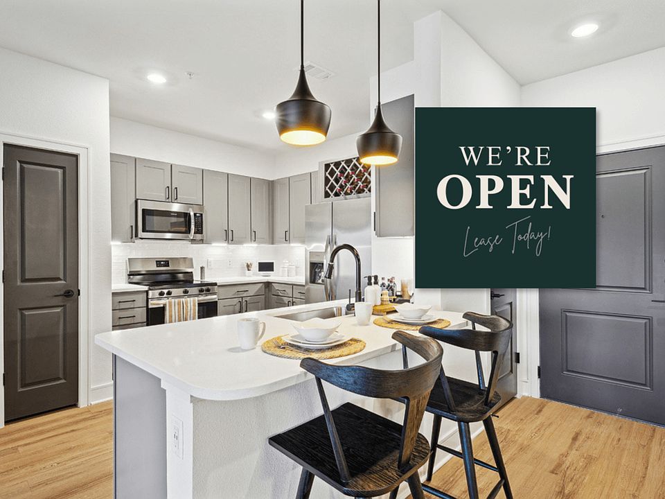 Kitchen with Quartz Countertop and Stainless Steel Appliances.