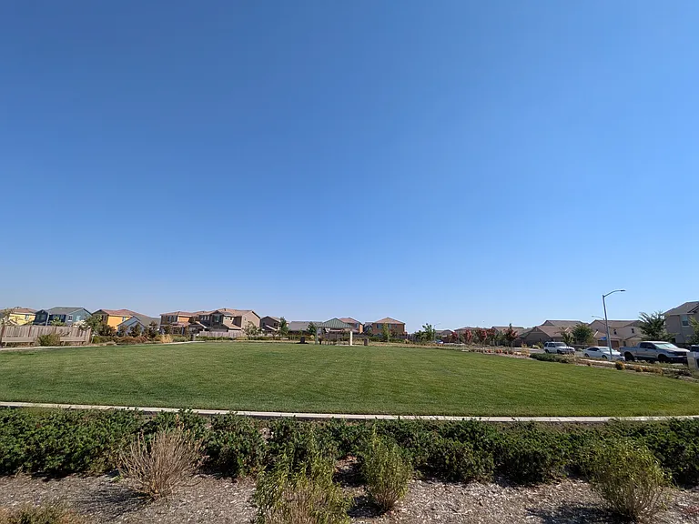 Relax in the expansive, open green spaces within the community. This serene environment offers the perfect retreat for outdoor relaxation and quiet moments.