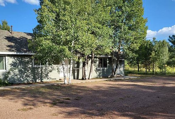 View of the front of units 7, 8, & 9. Parking is directly in front of the each units with sidewalk to front door.