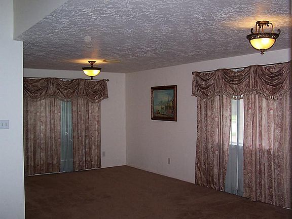 Formal living and dining room. 11 X 23. Recently installed carpet.