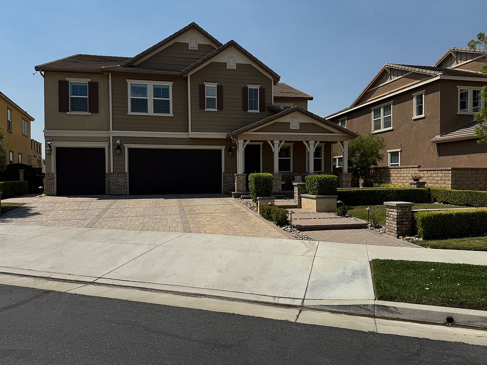 Front of Home with plenty of extra parking. Courtyard up front for hanging out.