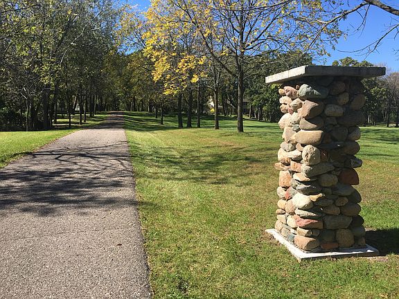 Entry w/ nat. stone pillars 