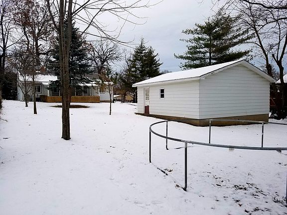 Covered Patio, concrete floor at rear door