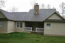 Covered Rear porch with Doors Leading to Master and Dining Room 