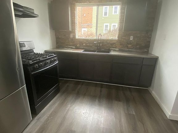 Kitchen with brick back splash