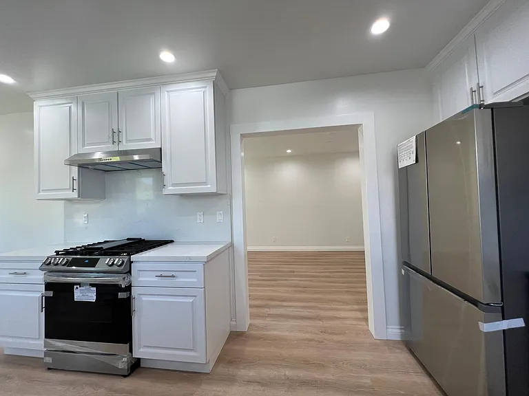 Kitchen peering into dining room.