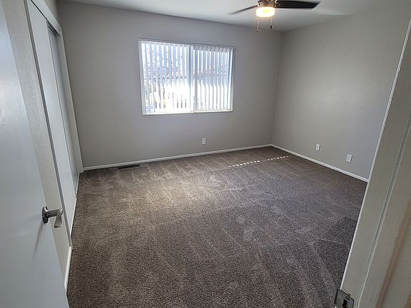 Spacious bedrooms with ceiling fans.