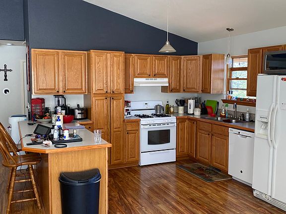 Kitchen with wood floor and counter/bar