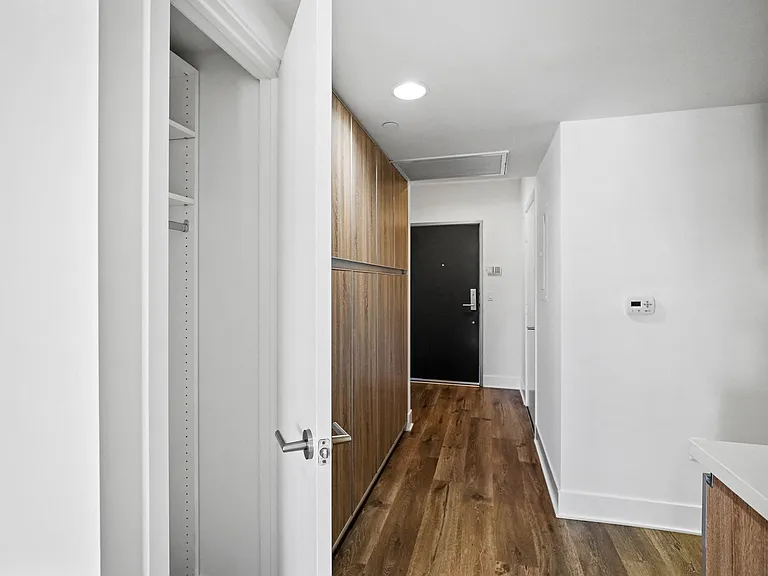 Hallway with Closet and Cabinet Storage