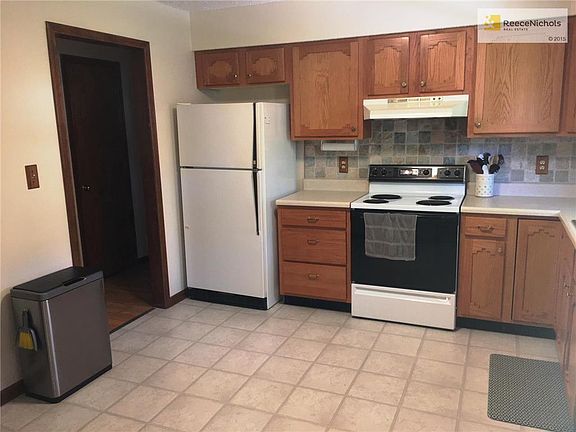 Replacement cabinets, tile backsplash, all appliances stay.