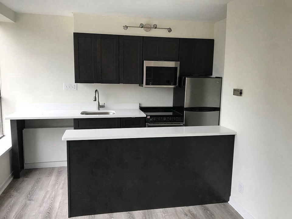 Brand new kitchen with quartz counters and stainless applian