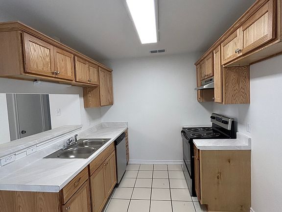 Kitchen with NEW CABINETS. New refrigerator will be installed prior to move in.
