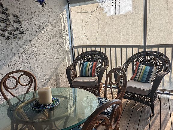 Back porch that is screened in. It's great for catching a sunset