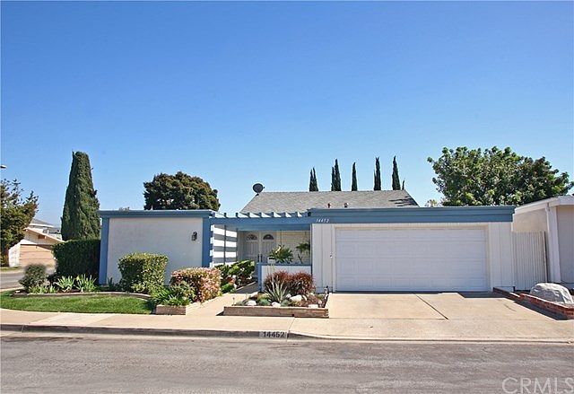 Corner lot with beautiful roses on side of home