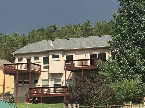 Rear of home faces lake